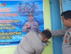 Cuaca Buruk, Sat Binmas Polres Takalar Pasang Spanduk Himbauan Kepada Nelayan